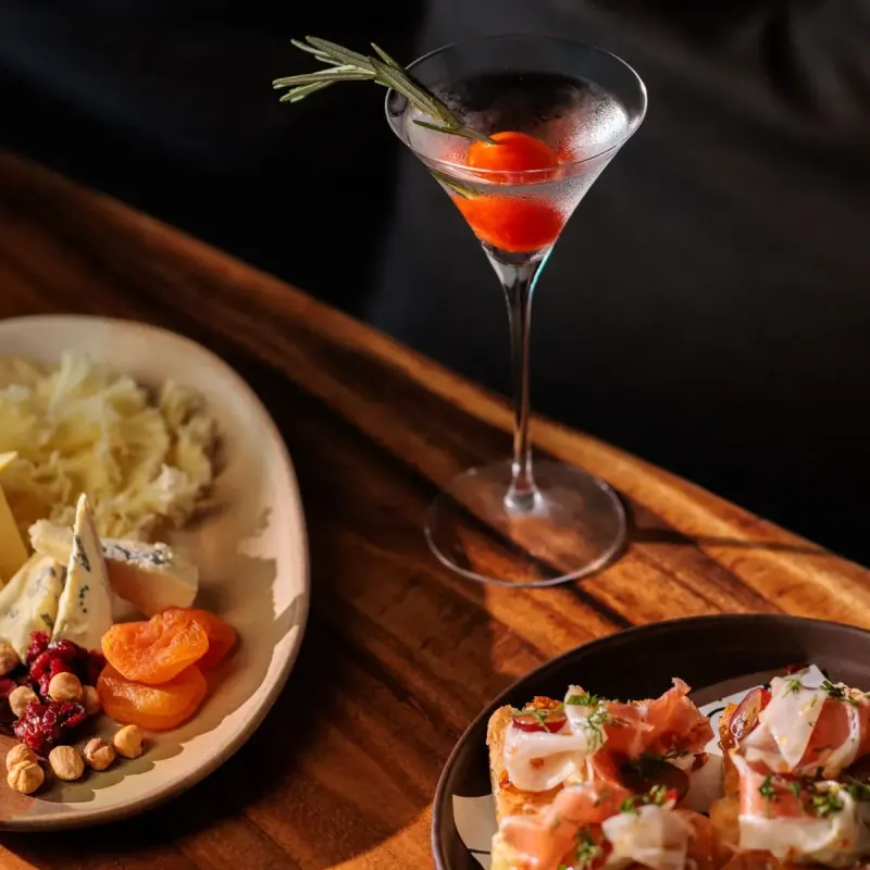 Martini with cheese and charcuterie board